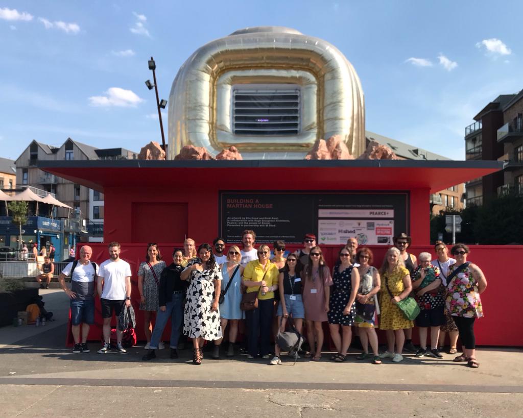 A group of project participants and designers in front of the Martian House in Bristol.